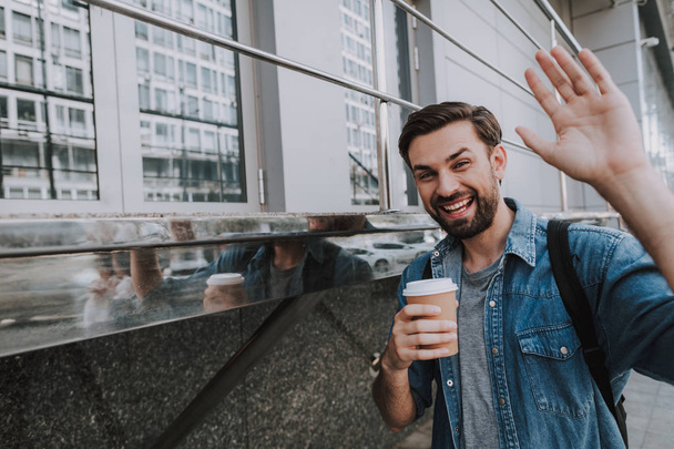 Happy man drinking cup of coffee outdoor - 写真・画像