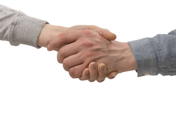Una stretta di mano ferma tra due partner su sfondo bianco isolato. Immagine
. - Foto, immagini