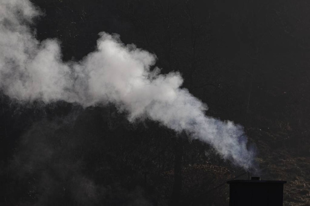 White smoking chimney with a dark background - Photo, Image