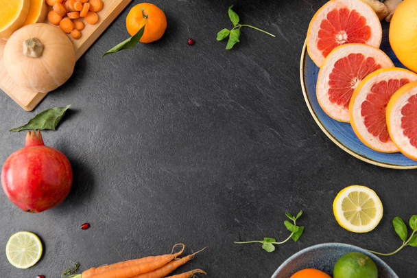 different vegetables and fruits on on slate table - Photo, image