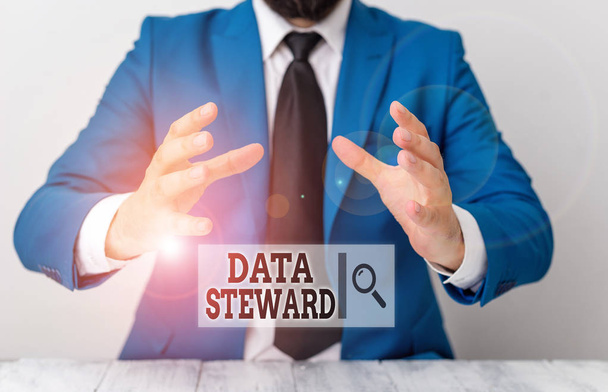 Handwriting text writing Data Steward. Concept meaning responsible for utilizing an organization s is data governance Man holds empty paper with copy space in front of him Space. - Photo, Image