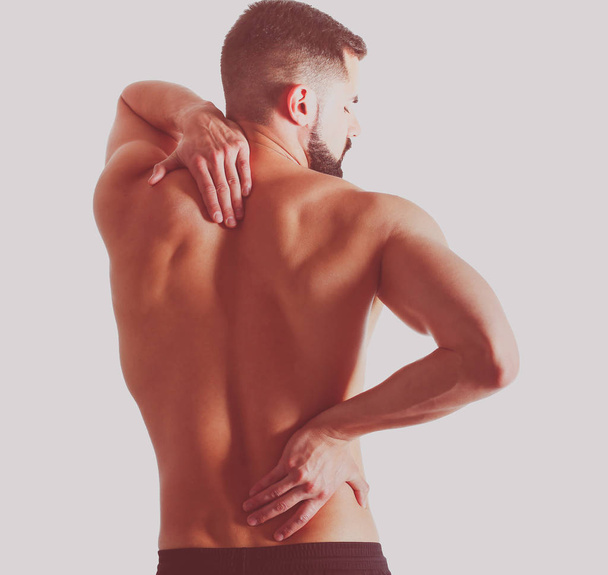 Young man holding his neck in pain. Medical concept - Foto, immagini