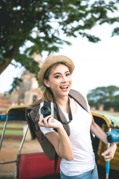 Young asian female traveler with backpack traveling Ayutthaya Pr - Photo, Image