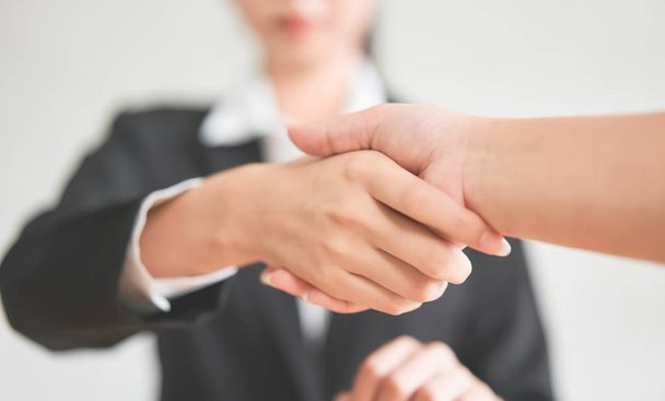 Close up of partnership handshake successful after negotiating business. Connection deal concept. - Foto, Imagen