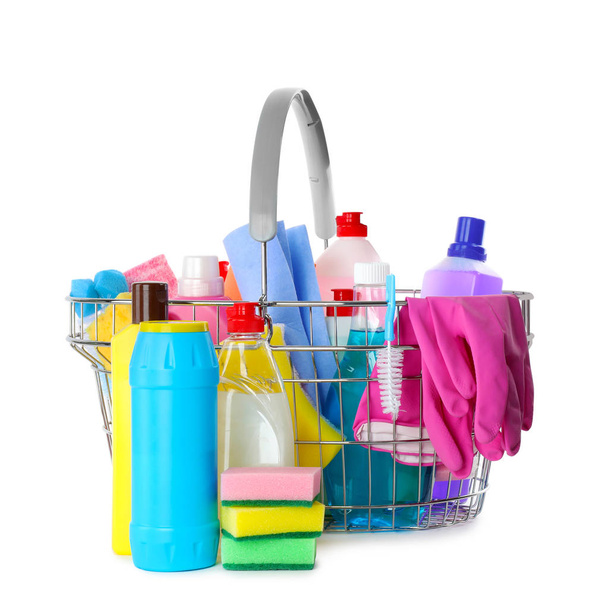 Metal shopping basket with different household chemicals on white background - Photo, Image