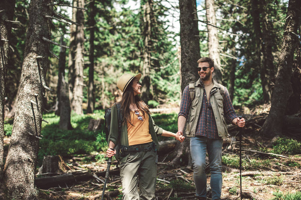Two traveler in special clothes walking on forest - Photo, Image