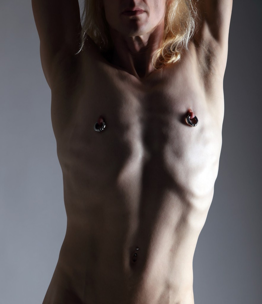 Male body with piercings - Foto, Imagen