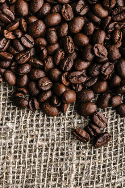 Coffee beans on burlap background - Foto, Imagem