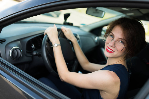 young beautiful woman posing in car  - Φωτογραφία, εικόνα