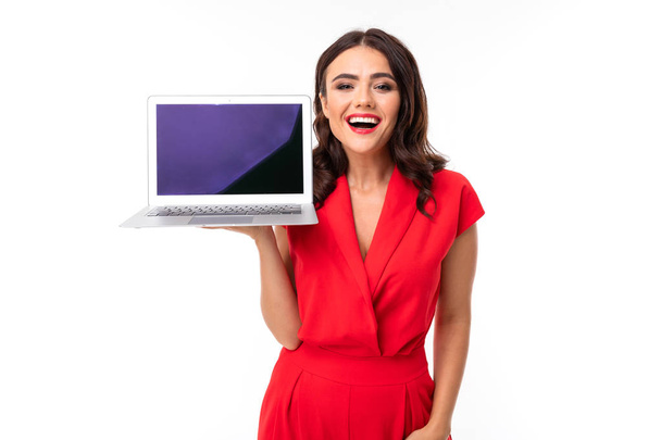 beautiful woman in red with laptop  - Фото, зображення