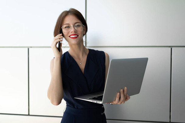 young beautiful businesswoman with laptop - Фото, изображение