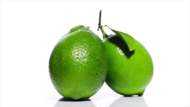 Limes on a white table, rotation 360 degrees. White background.Ultra high definition 3840X2160.4K resolution - Footage, Video