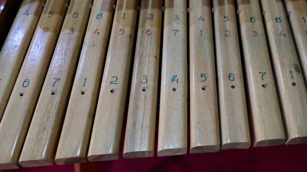  Kolintang or kulintang is a musical instrument consisting of rows of small gongs placed horizontally. - Photo, Image