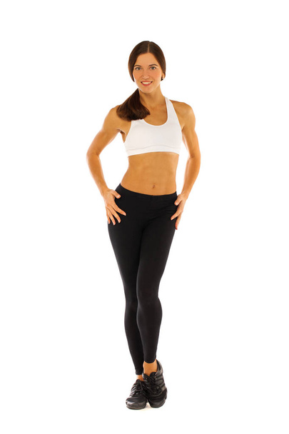 Young healthy girl doing exercises, full length portrait isolate - Foto, afbeelding