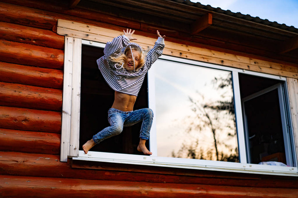 girl jumping and having fun. Happy childhood, games, fun. - Foto, Bild