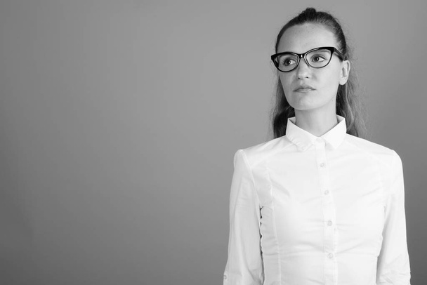 Portrait of young beautiful businesswoman shot in black and white - Zdjęcie, obraz