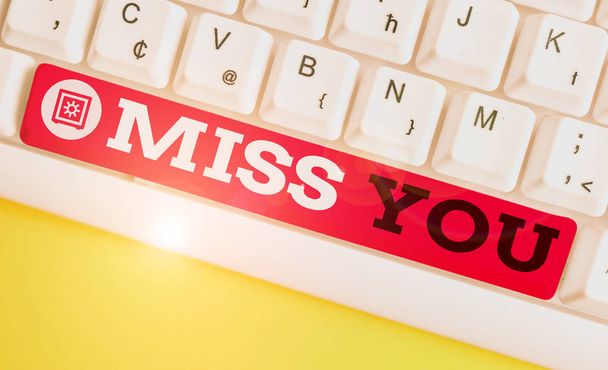Handwriting text Miss You. Concept meaning Longing for an important demonstrating in your life for a period of time White pc keyboard with empty note paper above white background key copy space. - Photo, Image