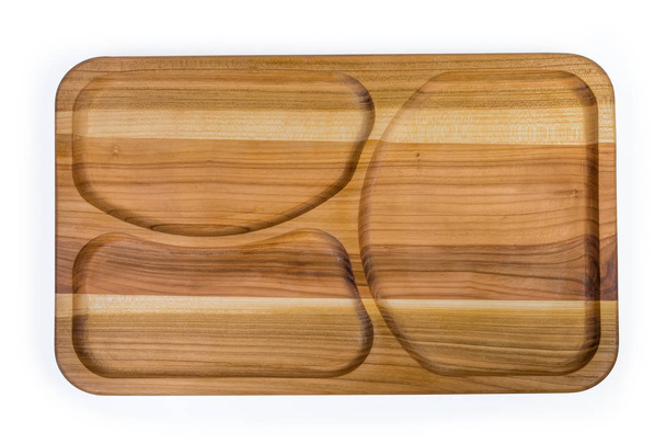 Bovenaanzicht van de houten compartiment schotel met drie afdelingen - Foto, afbeelding