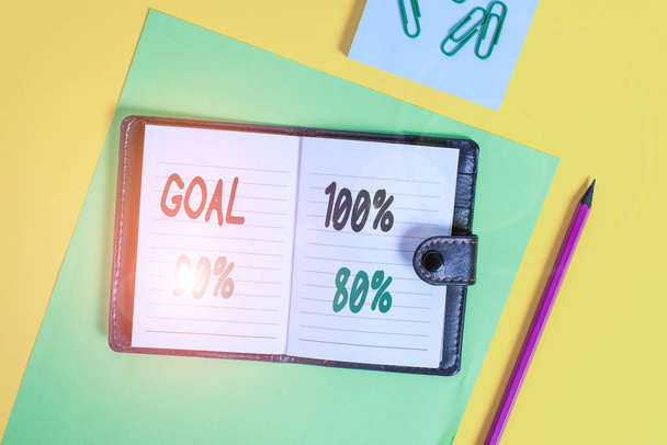 Conceptual hand writing showing Goal 100 Percent 90 Percent 80 Percent. Business photo showcasing Percentage of your objectives fulfilment success level Locked diary striped sheets clips notepad - 写真・画像