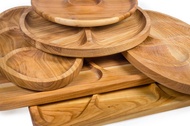 Stack of different wooden compartment dishes and serving boards  - Valokuva, kuva
