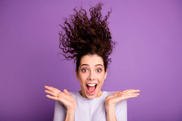 Close-up portrait of her she nice-looking attractive lovely crazy cheerful cheery wavy-haired girl hair blowing up having fun isolated over violet lilac purple pastel color background - Foto, Imagem