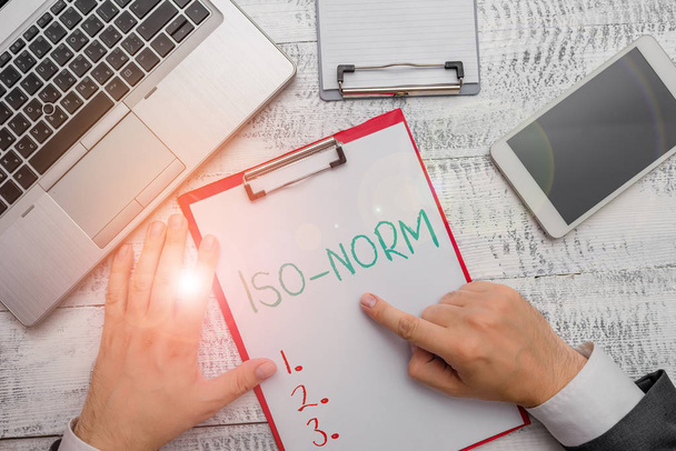 Conceptual hand writing showing Iso Norm. Business photo showcasing An accepted standard or a way of doing things most showing agreed. - Photo, Image
