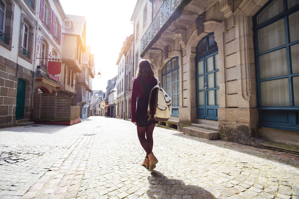 girl is walking in the old town Morlaix  - Fotó, kép