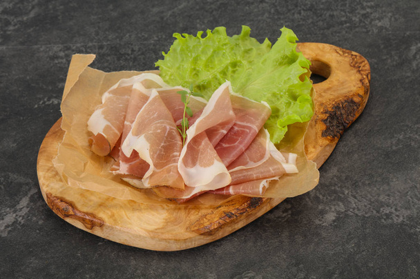 Italian prosciutto pork meat over board - Photo, Image