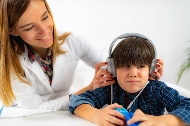 Boy Having a Hearing Exam in the Audiologist's Office - Photo, Image