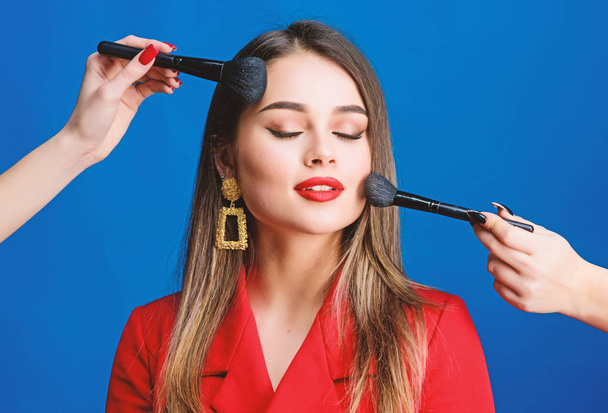 Sexy woman with professional makeup brush tool. Fashion portrait of woman. jewelry earrings. Girl in red jacket. beauty and fashion. hair beauty and hairdresser salon. Feeling flirty - Zdjęcie, obraz