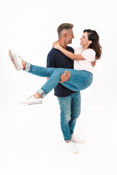 Full length of a happy man holding his girlfriend - Fotografie, Obrázek