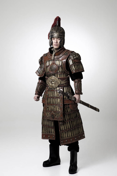 Adult male wearing very old armor. - Фото, изображение
