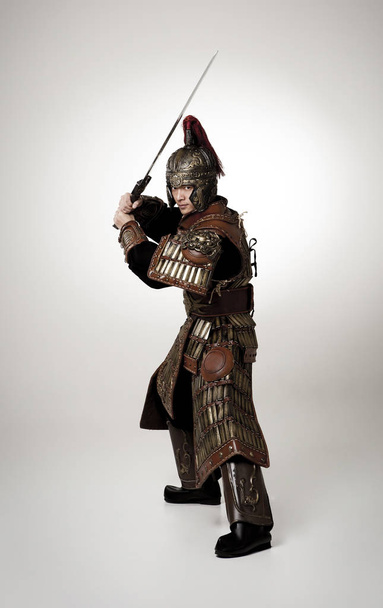 Adult male wearing very old armor. - Photo, Image