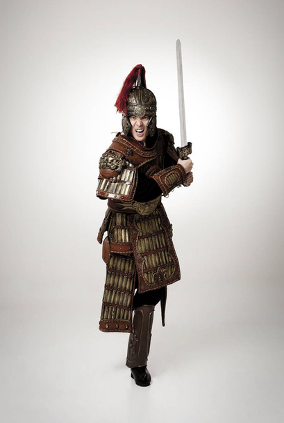 Adult male wearing very old armor. - Fotoğraf, Görsel