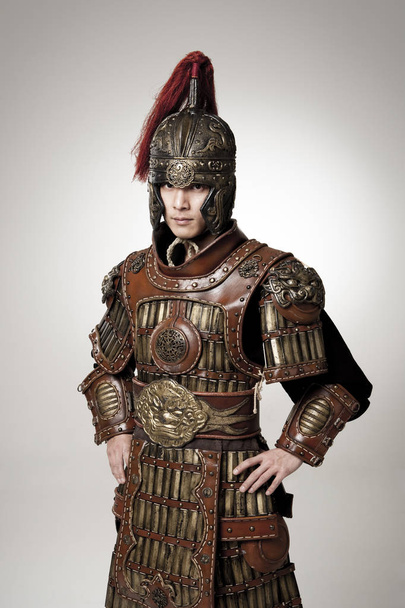 Adult male wearing very old armor. - Valokuva, kuva