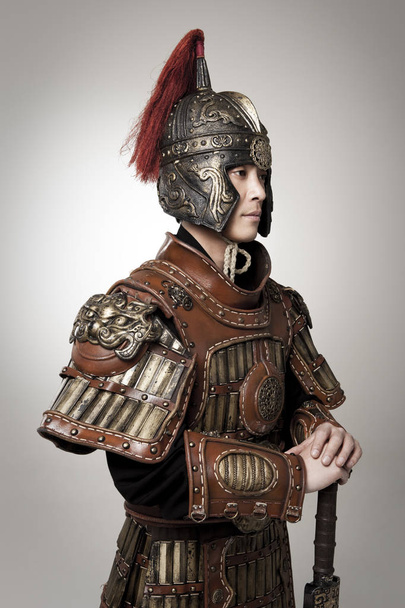 Adult male wearing very old armor. - Φωτογραφία, εικόνα