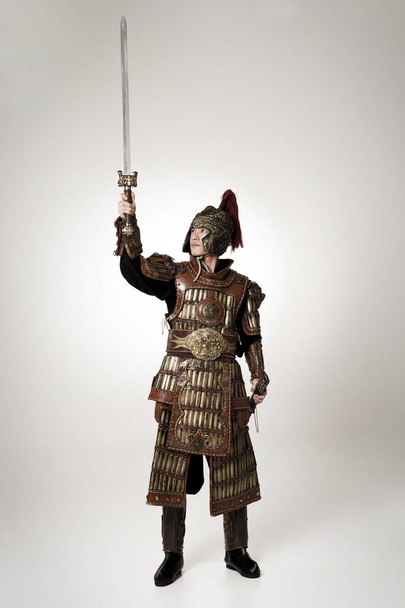 Adult male wearing very old armor. - Foto, Imagen