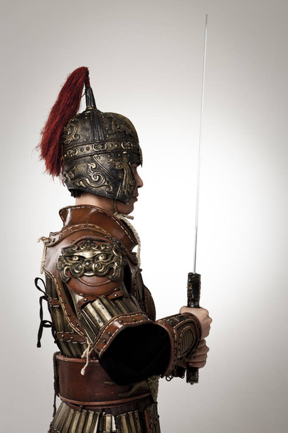 Adult male wearing very old armor. - Fotó, kép