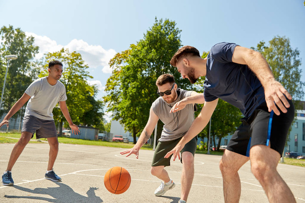 group of male friends playing street basketball - Φωτογραφία, εικόνα