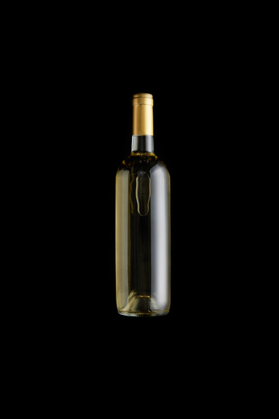 top view of bottle with white wine isolated on black - Fotografie, Obrázek