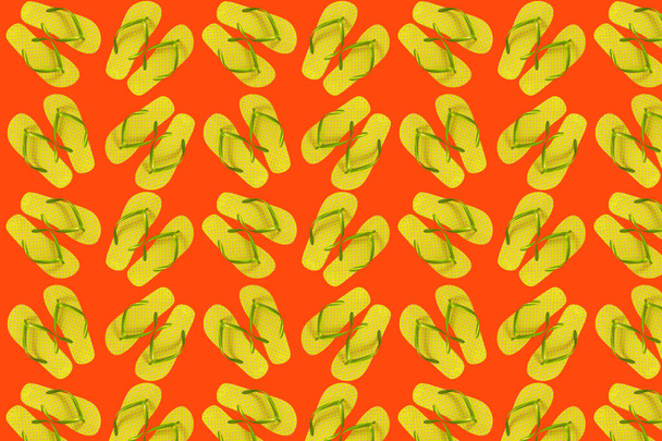 Seamless pattern from yellow flip flops on a bright orange background. - Photo, Image