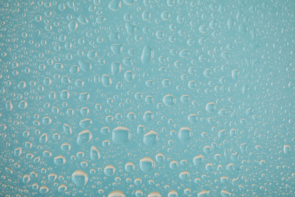 clear transparent water drops on blue background - Foto, Imagem