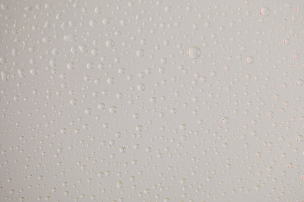 clear transparent water drops on grey background - Fotografie, Obrázek
