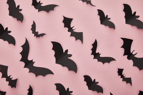 top view of paper bats on pink background, Halloween decoration - Photo, Image