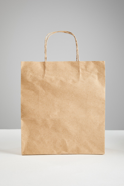 paper shopping bag isolated on grey, black Friday concept - Φωτογραφία, εικόνα