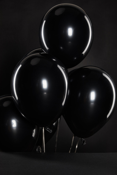 black balloons isolated on black, black Friday concept - Foto, afbeelding