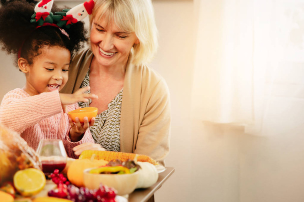 Little Girl Eating  and smile Thanksgiving Celebration Concept.  - 写真・画像