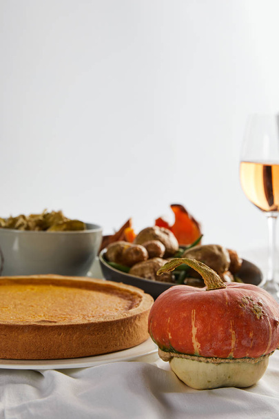 pumpkin pie, baked vegetables and whole pumpkin isolated on grey - Foto, immagini
