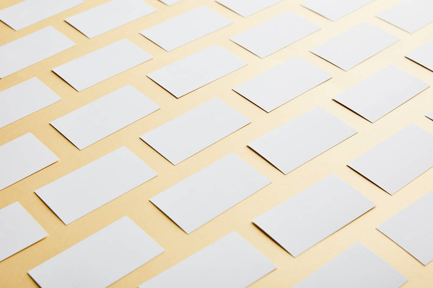 flat lay of empty and blank business cards with copy space on yellow background  - Φωτογραφία, εικόνα