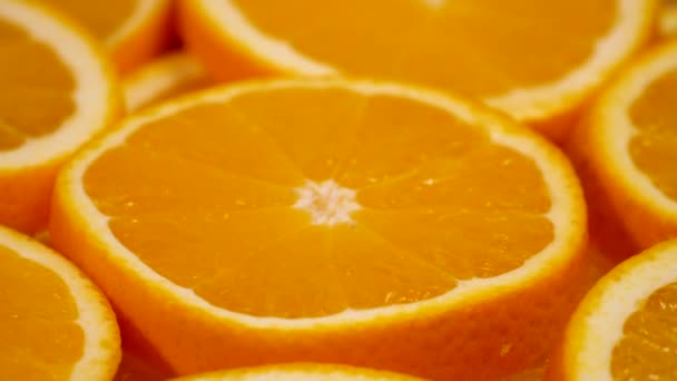 Marco shot of orange fruit and rotate.Close up flesh citrus orange. Nature background. - Filmati, video
